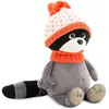 Raton laveur avec bonnet orange Denny (25 cm assis)