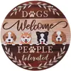 TIAKI Plaque de porte "Dogs Welcome - People Tolerated" Ø 30 cm