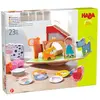 HABA Stapelspiel Tierischer Balanceakt: 1 Wackelwiese, 12 Stapelsteine, 10 Spielplättchen.