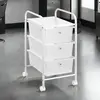 Idimex Caisson sur roulettes GINA chariot 3 tiroirs en plastique blanc transparent et 1 tablette, meuble de rangement en métal laqué blanc