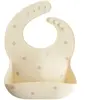 Mushie Bavoir à poche en silicone Pretzel