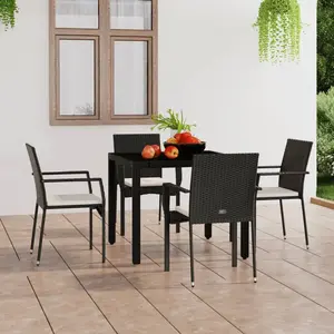 vidaXL Chaises de jardin 4 pcs avec coussins Résine tressée Noir pas cher