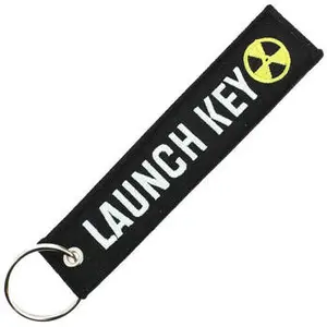 CLJ - Porte-clés - NUCLEAR LAUNCH KEY - DANS LA POCHE DE VLADIMIR - Noir et blanc - Sécurité aviation - Urgence
