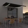 Image de vidaXL Auvent manuel rétractable avec LED 450x300 cm Anthracite