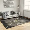Image de vidaXL Tapis lavable noir et doré 160x230 cm antidérapant