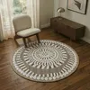 Image de Tapis rond aspect jute motifs en relief blanc diamètre 90