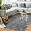 Image de Tapis en cuir tressé gris clair 160x230