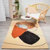 Image de tapis salle à manger 200x290 fait main en laine beige et orange motif géométrique