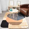 Image de tapis chambre 120x170 fait main en laine beige et bleu motif géométrique