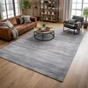 Image de tapis salon 200x300 fait à la main en viscose marron rectangle motif uni NEO +
