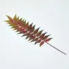 Image de Branche de fougère tropicale artificielle - Homescapes - 72 cm - Vert et Rouge - Entretien facile - Style urbain