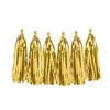 Image de Guirlande tassel 12 pompons dorés métallisés 1.5m