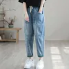 Image de Jean femme - trous déchirés - dessus plat - ample - droit - pantalon fin neuf points - poches - vert