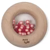 Image de Donut sensoriel en bois Tomate - PETIT BOUM - Rose - Bois / Plastique