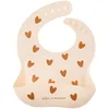 Image de Bavoir en silicone Coeurs Crème