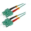 Image de Helos - Cordon de raccordement - SC multi-mode (M) pour SC multi-mode (M) - 3 m - fibre optique - duplex - 50 / 125 microns - OM3 - turquoise