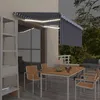 Image de vidaXL Auvent rétractable manuel avec store LED 3,5x2,5m Bleu et blanc
