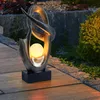 Image de Globo   Lampe solaire d'extérieur effet flamme   Verre craquelé résistant aux intempéries   1x LED 3000K   Longueur 25,5 cm   Autonomie 8h