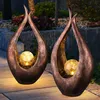 Image de Lot de 2 lampes solaires d'extérieur à led, verre, sphère, cour, spots, bronze, courbes