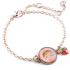 Image de Djeco armband tinyly Berry - goudkleurig kindersieraad met bedel.