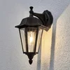 Image de Lindby - Wandlamp buiten - 1licht - Aluminium, glas - H: 31.3 cm - E27 - zwart-roest, helder