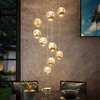 Image de Lucande - hanglamp - 9lichts - Glas, metaal - helder, goud - Inclusief lichtbronnen