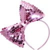 Image de hoofdband met paillettenstrik rose